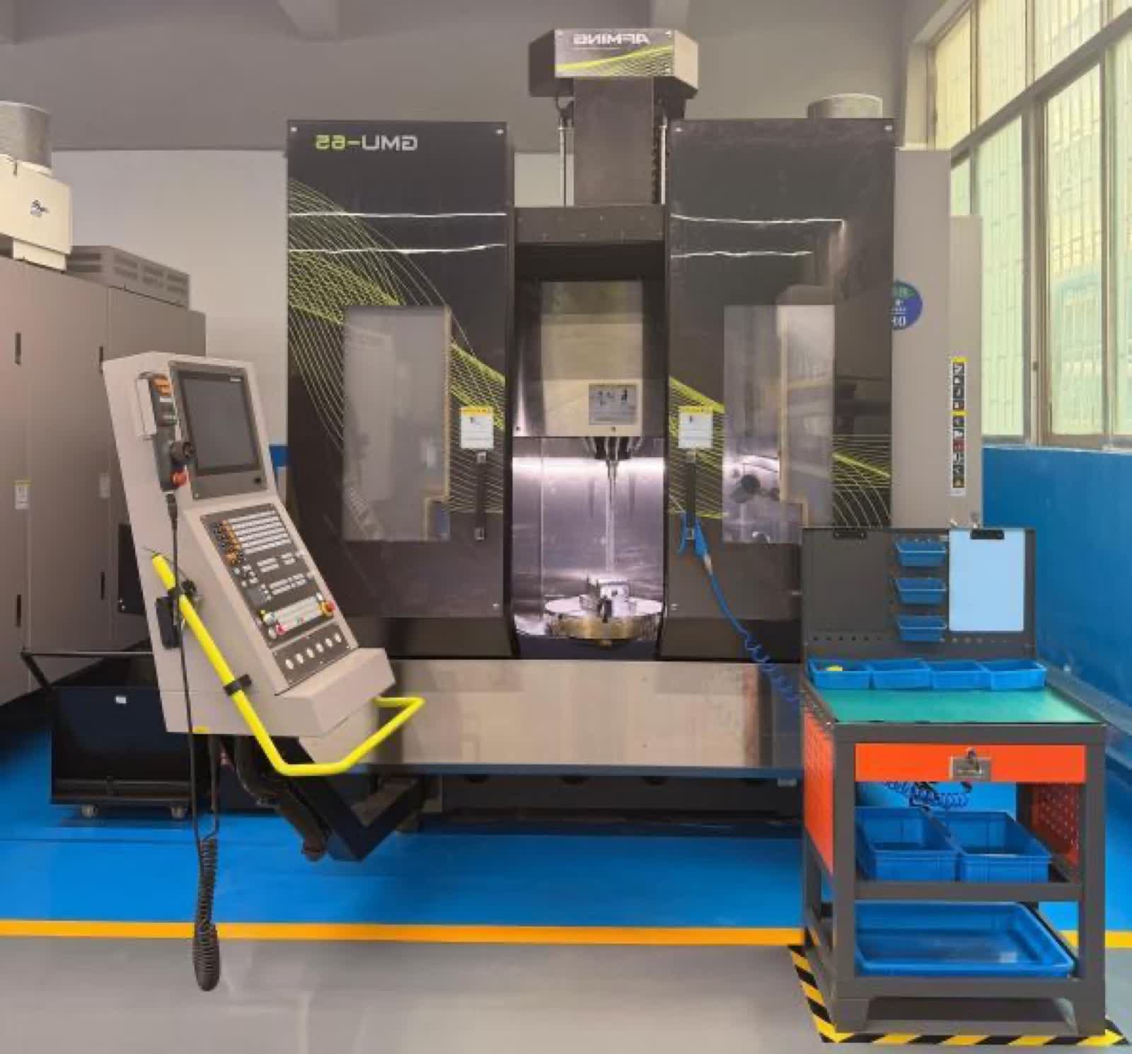 An AEMING GMU-65 machining centre on Fudakin's Shenzhen floor.